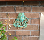 Art Nouveau inspired sculpture of beautiful female face with long stylised hair
